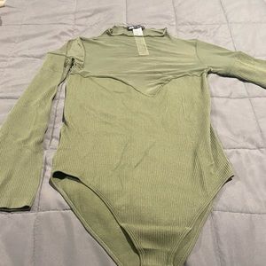 Green bodysuit with mesh parts on it. Fits very comfortable